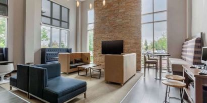 Lobby and coworking lounge at Cambria Suites Denver Airport.