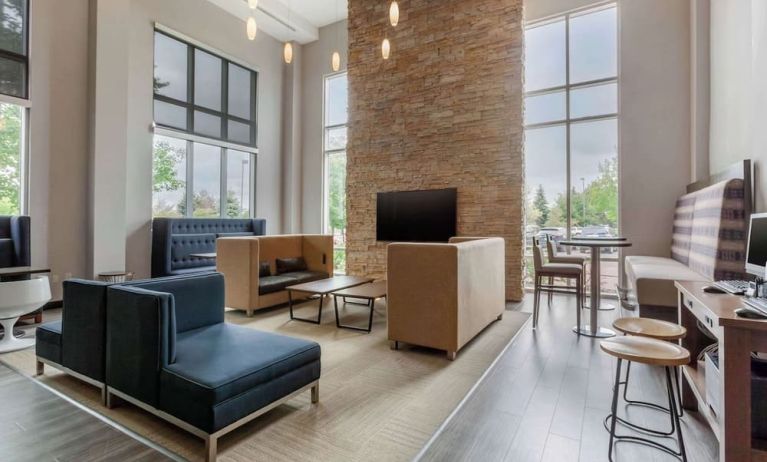 Lobby and coworking lounge at Cambria Suites Denver Airport.