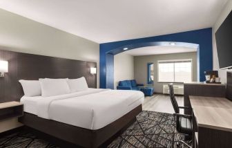 Day use room with living area and work desk at La Quinta Inn & Suites - North Stone Oak.