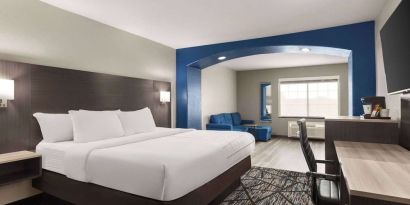 Day use room with living area and work desk at La Quinta Inn & Suites - North Stone Oak.