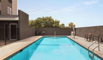 Refreshing outdoor pool at La Quinta Inn & Suites - North Stone Oak.