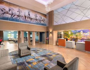 Lobby and coworking lounge at La Quinta Inn & Suites - North Stone Oak.