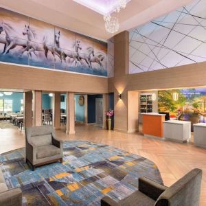 Lobby and coworking lounge at La Quinta Inn & Suites - North Stone Oak.