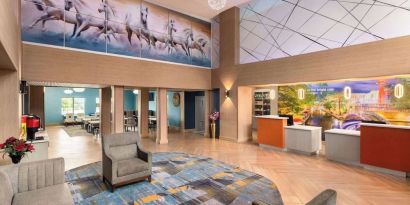 Lobby and coworking lounge at La Quinta Inn & Suites - North Stone Oak.