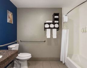 Guest bathroom with shower and tub at La Quinta Inn & Suites - North Stone Oak.