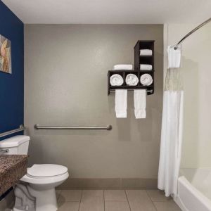 Guest bathroom with shower and tub at La Quinta Inn & Suites - North Stone Oak.