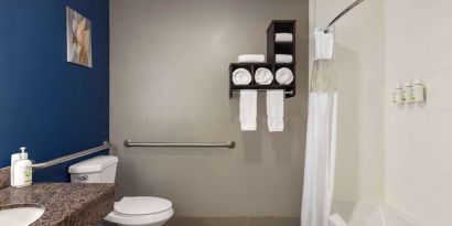 Guest bathroom with shower and tub at La Quinta Inn & Suites - North Stone Oak.