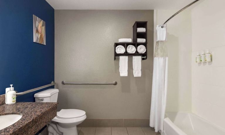 Guest bathroom with shower and tub at La Quinta Inn & Suites - North Stone Oak.