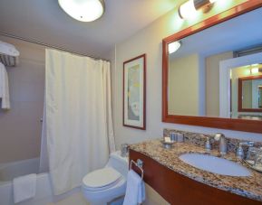 Guest bathroom with shower and tub at San Carlos Hotel.