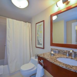 Guest bathroom with shower and tub at San Carlos Hotel.