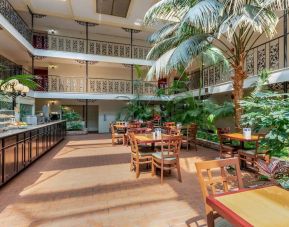 Dining area perfect for coworking at Coratel Plus Suites Wichita West Airport.