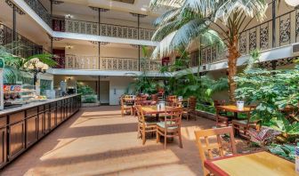 Dining area perfect for coworking at Coratel Plus Suites Wichita West Airport.