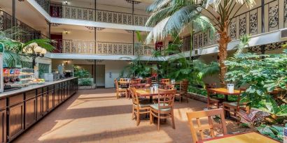 Dining area perfect for coworking at Coratel Plus Suites Wichita West Airport.