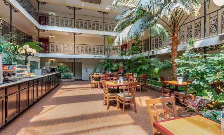 Dining area perfect for coworking at Coratel Plus Suites Wichita West Airport.