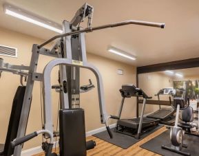 Fitness center at Coratel Plus Suites Wichita West Airport.