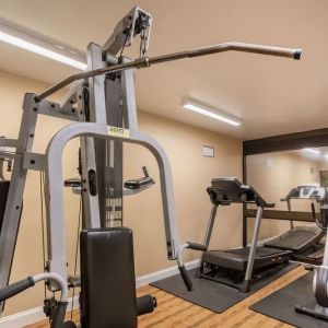 Fitness center at Coratel Plus Suites Wichita West Airport.