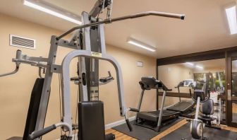 Fitness center at Coratel Plus Suites Wichita West Airport.