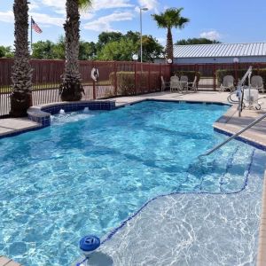 Refreshing outdoor pool at Hampton Inn Deer Park.