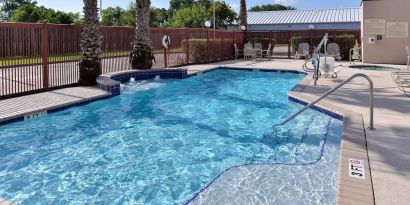 Refreshing outdoor pool at Hampton Inn Deer Park.