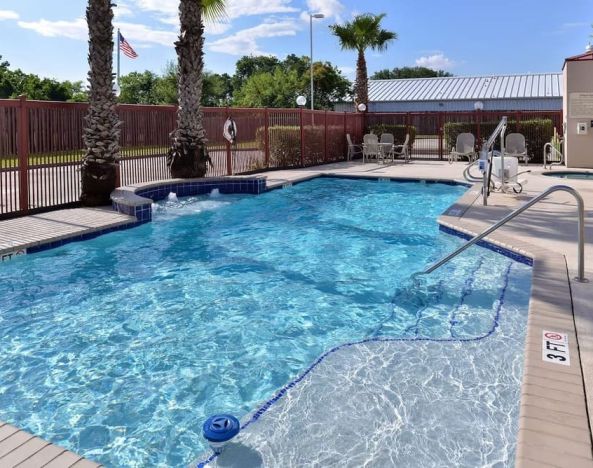 Refreshing outdoor pool at Hampton Inn Deer Park.