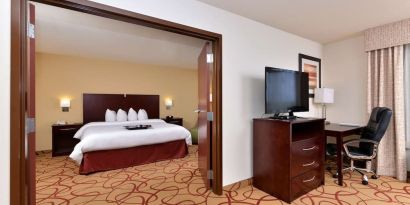 Day use room with living area and work desk at Hampton Inn Deer Park.