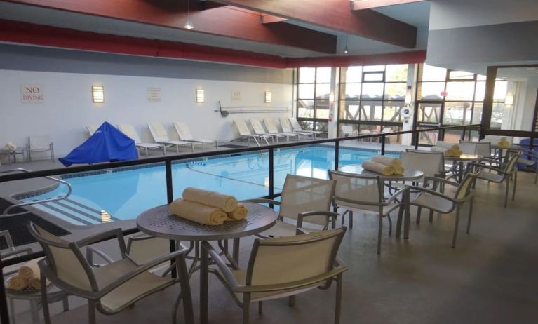 Tables and chairs available beside pool at DoubleTree By Hilton Westborough.