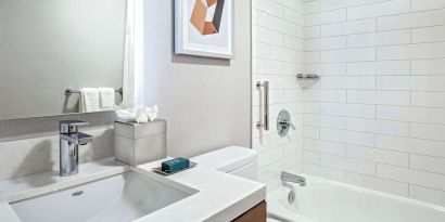 Guest bathroom with shower and tub at DoubleTree By Hilton Westborough.