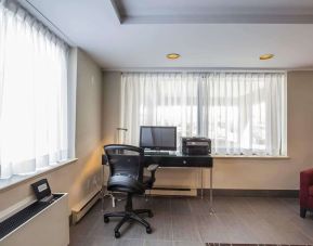 Business center with computer, printer and ergonomic chair at Comfort Inn Pickering.