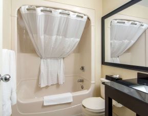 Guest bathroom with tub at Comfort Inn Parry Sound.