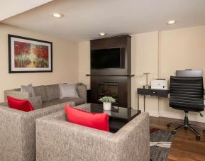 Lobby lounge Lobby lounge with workspace, TV screen and fireplace at Comfort Inn Ottawa East.