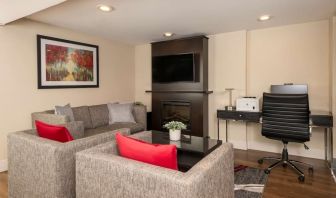 Lobby lounge Lobby lounge with workspace, TV screen and fireplace at Comfort Inn Ottawa East.