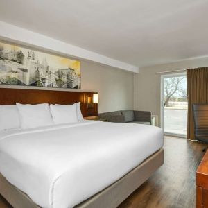 Day use room with TV, sofa, work desk and private bathroom at Comfort Inn Ottawa East.