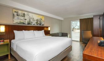 Day use room with TV, sofa, work desk and private bathroom at Comfort Inn Ottawa East.