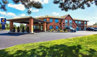 Hotel entrance and parking area at Comfort Inn Cobourg.