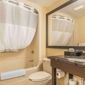 Guest bathroom with tub and free toiletries at Comfort Inn Cobourg.