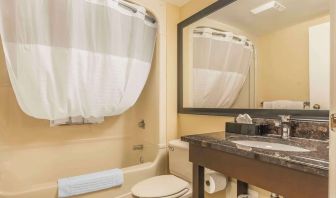 Guest bathroom with tub and free toiletries at Comfort Inn Cobourg.