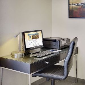 Business center with computer, printer and ergonomic chair at Comfort Inn Cobourg.