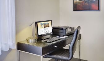 Business center with computer, printer and ergonomic chair at Comfort Inn Cobourg.