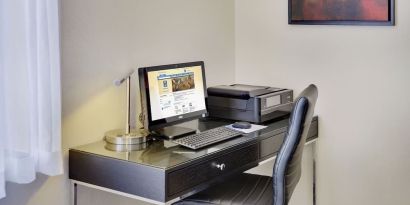 Business center with computer, printer and ergonomic chair at Comfort Inn Cobourg.