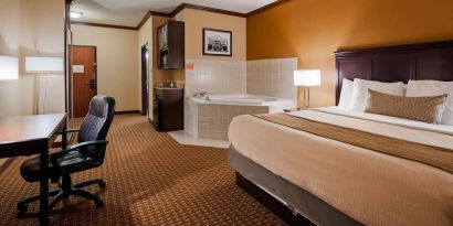 Day use room with bath tub and work desk at Best Western Granbury Inn & Suites.