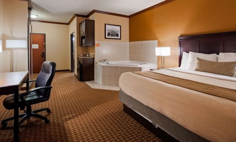 Day use room with bath tub and work desk at Best Western Granbury Inn & Suites.