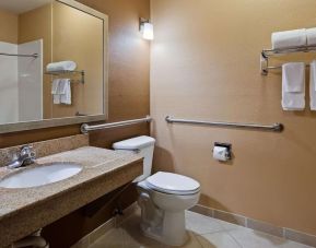 Guest bathroom with shower at Best Western Granbury Inn & Suites.