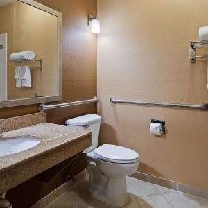 Guest bathroom with shower at Best Western Granbury Inn & Suites.