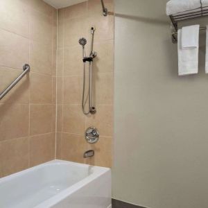 Guest bathroom with shower and tub at Wyndham Garden Pittsburgh Airport.