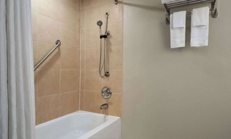 Guest bathroom with shower and tub at Wyndham Garden Pittsburgh Airport.