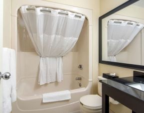 Guest bathroom with tub at Comfort Inn Orillia.