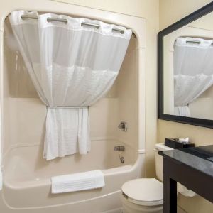 Guest bathroom with tub at Comfort Inn Orillia.