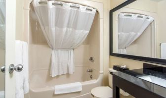 Guest bathroom with tub at Comfort Inn Orillia.