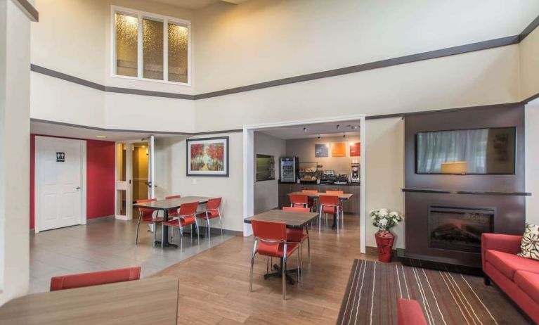 Lobby lounge with fireplace and comfortable sitting at Comfort Inn New Glasgow.