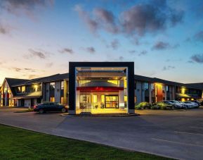 Hotel entrance and parking area at Comfort Inn Newmarket.